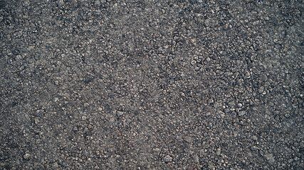 Granite gravel of macadam, Rock gray crushed for construction on the ground, Scree texture background