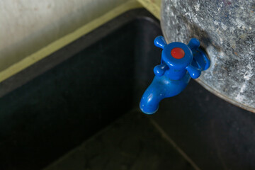 Plastic crane on galvanized tank