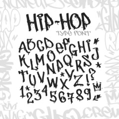 Hip-Hop Graffiti type font with street art doodle style elements isolated on white. Graffiti alphabet with numbers. Street art frame design. Vector template