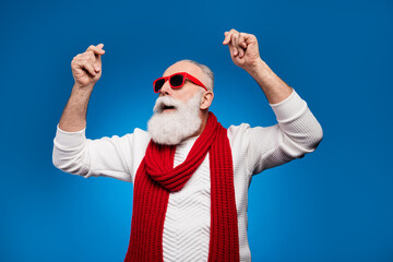 Photo of cute attractive mature man dressed white pullover red glasses dancing smiling isolated blue color background