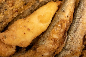 Small fried fish, surface texture, background image, close-up, selective focus.