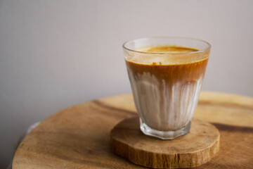 dirty coffee on a wooden dish, home café