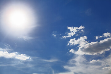 Sun glowing on the blue sky