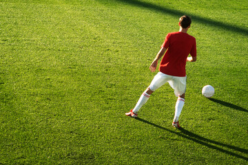 soccer players kicking football ball. Man play soccer on sports field.