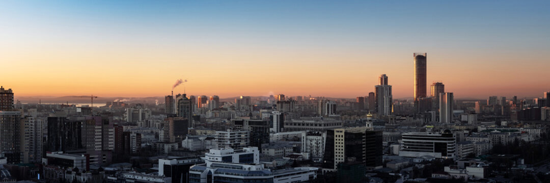 Dawn sun over the metropolis of early sunset © kirillk
