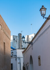 Detachment of a street with street lamps in the historical center of Galatina, Lecce, Puglia, Italy