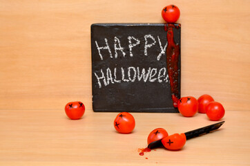 original decoration painted tomatoes and happy halloween lettering