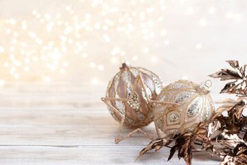 Fototapeta na wymiar Golden christmas balls with bokeh.