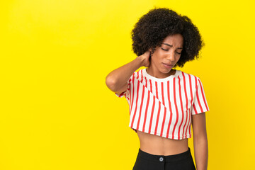 Young African American woman isolated on yellow background with neckache
