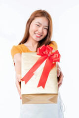Cute teenage female feeling happily and showing gift box present isolated on white background