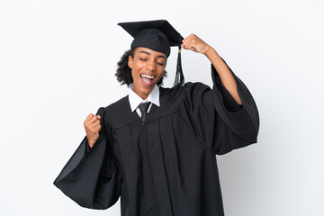 Young university graduate African American woman isolated on white background celebrating a victory