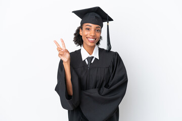 Young university graduate African American woman isolated on white background smiling and showing...