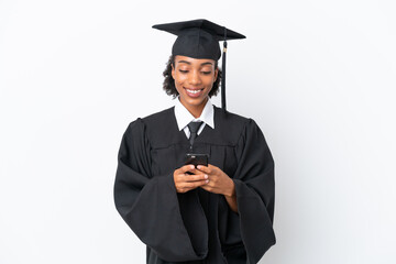 Young university graduate African American woman isolated on white background sending a message with the mobile