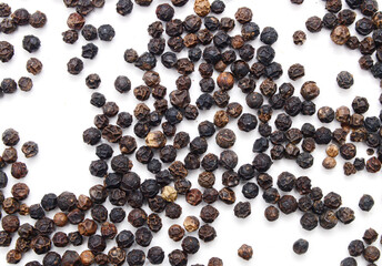 Red and black peppercorns, isolated on white background 