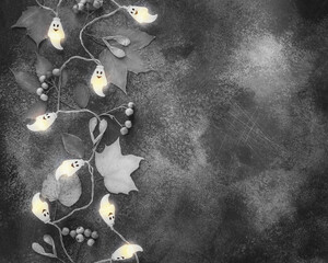 Halloween composition with light garland with ghosts and autumn leaves on textured background with...