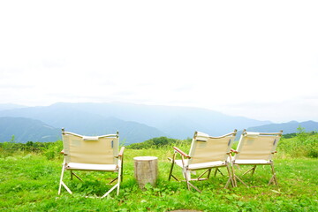 Having A Picnic In the Countryside, Camp Chair in the Fresh Green Meadow - アウトドア ピクニック 椅子と机