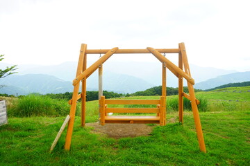 Natural Wooden Swing on Green Grass - 日本 愛媛 四国カルスト 木製 ブランコ	
