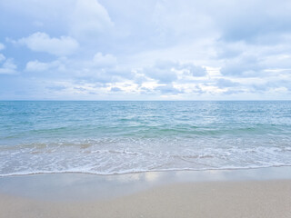 Fototapeta na wymiar Sand beach and blue sea and blue sky