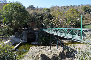 A riverside image of a rural Bridge in Udaipur village, Rajasthan, India