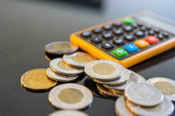 Pocket Calculator with coins - Financial business savings wealth concept