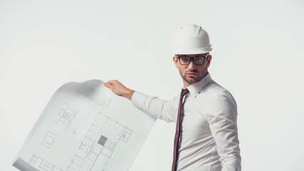 Architect in hardhat holding blueprint and looking at camera isolated on white