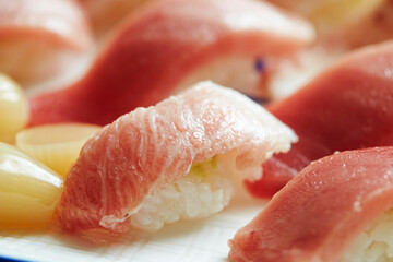 Various tuna sushi on a plate