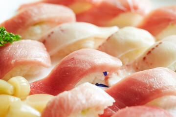 Various tuna sushi on a plate