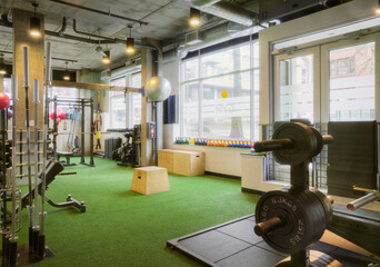 Weights room in an empty gym.
