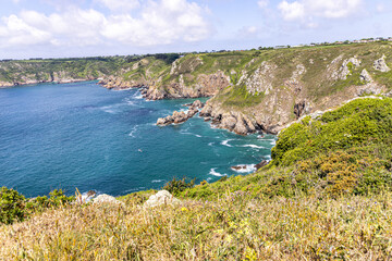 Fototapeta na wymiar The beautiful rugged south coast of Guernsey, Channel Islands UK viewed from Icart Point