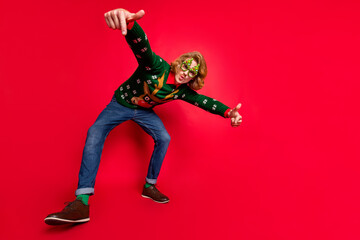 Full length body size view of attractive funky cool guy dancing fooling isolated over bright red color background