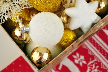Golden christmas decorations on box for tree and home