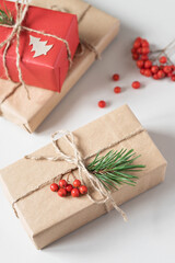 Christmas gift wrapping. Spruce branches and bunches of mountain ash
