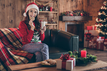 Fototapeta premium Photo of millennial nice brunette lady sit eat wear red sweater hat jeans at home alone