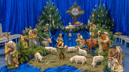 Christmas nativity scene with baby Jesus, Mary and Joseph in the manger with sheeps. Christmas...