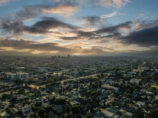 a gorgeous aerial shot of the cityscape of the city of Los Angeles with powerful clouds in the sky