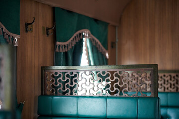 The interior of a steam-powered tourist retro train, stylized as Nikolaevskii Express and going...