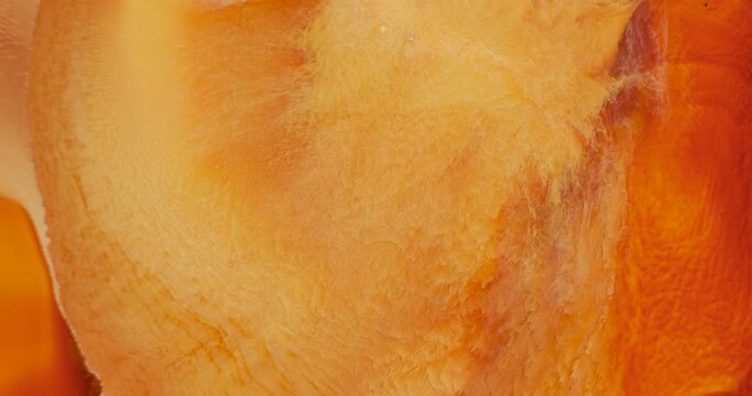 4k footage of orange ink abstract in motion, close-up. Flow art dynamic orange-yellow fluid paints. Texture of flowing orange colour set. Watercolor gold liquid background. Solar orange ink backdrop