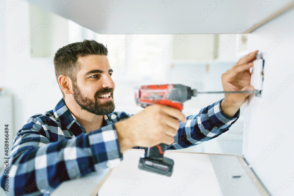 Wall mural Portrait of an electrician happy worker at work