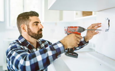 Portrait of an electrician happy worker at work