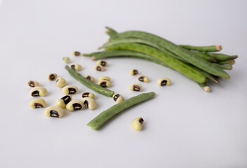 Fresh peas with black eyes ,white background