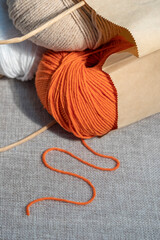 Fototapeta na wymiar A set of balls of knitting threads in a paper craft bag, close-up