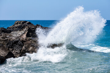 Heavy Atlantic seas with large waves crashing onto rocks on the beach at Ajuy on the Canary Island of Fuerteventura