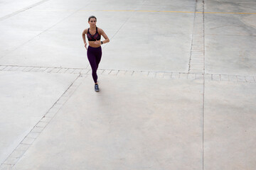 Fototapeta na wymiar Beautiful athlete woman training outdoors. Young fit woman doing exercise outside.