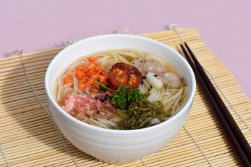 Ramen noodle bowl soup with raw vegetables vegetarian cuisine meal.