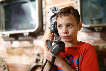 Boy with analog telephone receiver