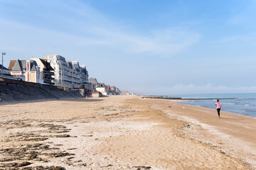 Running woman in the beach of Cabourg 