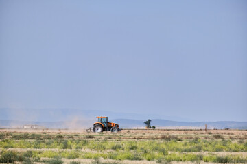 Tractor working in the harvest on a summer day in Castilla la Mancha