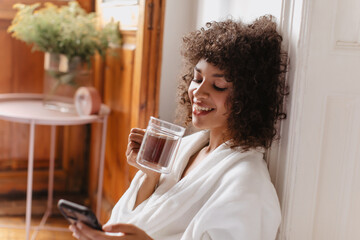 morning massage from beloved one to appealing brunette girlfriend made her smile. sitting near...