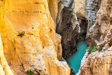 On the Caminito del Rey. A view of the golden steep cliffs of the narrow and vertiginous canyon of the Gaitanes gorges