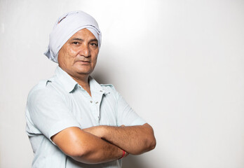 portrait of a confident indian rural man mid aged farmer on white background 